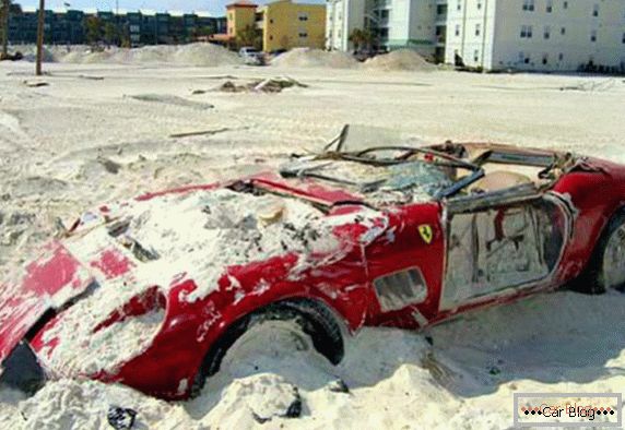 Ferrari 250 Spyder covered with sand