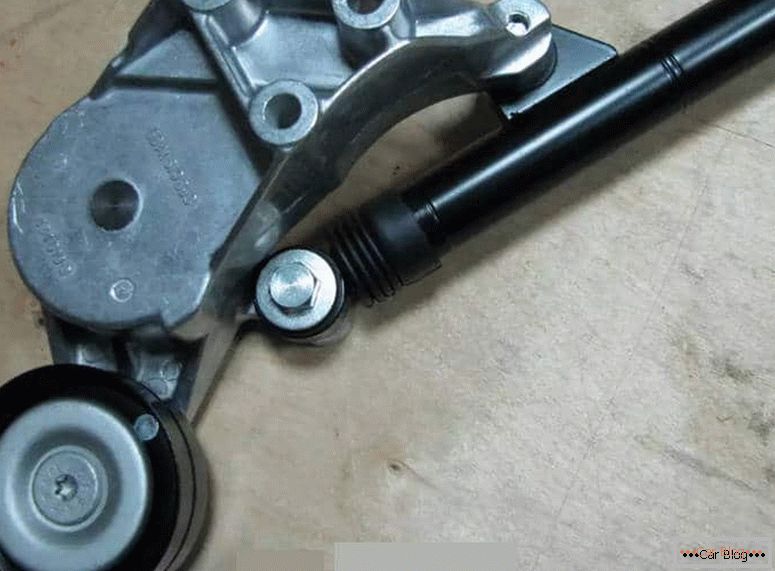 how to change the alternator belt tensioner pulley