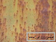 Photo point and ulcer manifestations of rust on the car body